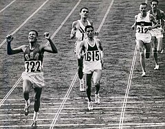 BillyMills Crossing Finish Line 1964Olympics.jpg