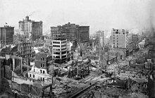 A historical image of damaged and destroyed buildings after the 1906 earthquake in San Francisco