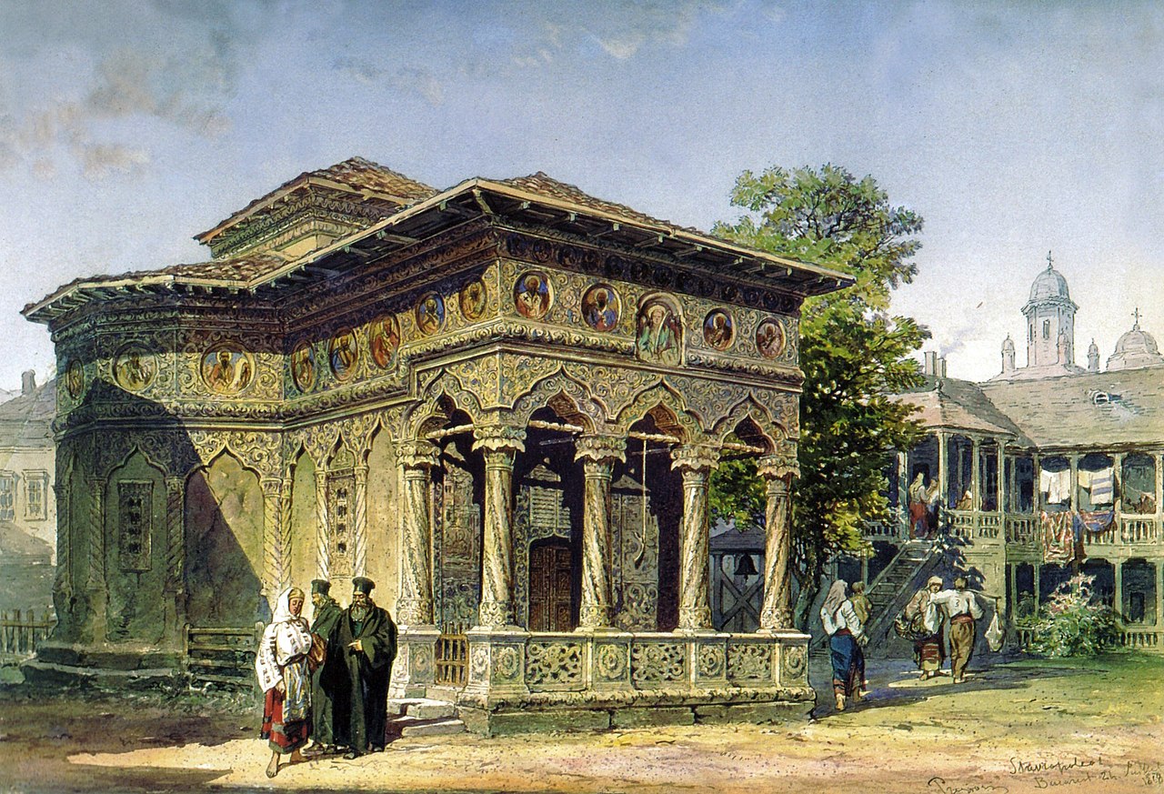 Building with pillars and people outside