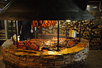 Texas-style barbecue smoke pit with various meats
