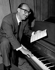 Sammy Cahn playing a piano.