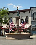 The Bear Fountain, the best-known (only?) symbol of Geneseo, New York, here decorated with flags for Memorial Day.