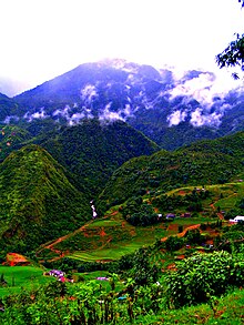 Photograph of the Sa Pa mountain hills with agricultural activity shiwn in the foreground