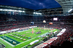 Photograph of London's Wembley Stadium during the opening ceremony of the 2010 NFL International series showing the field and the stands filled with fans