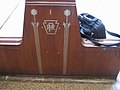 Photo of PRR herald engraved in wooden bench
