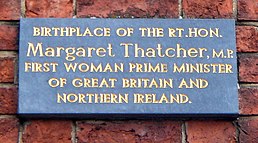 photograph of plaque reading "Birth place of the Rt.Hon. Margaret Thatcher, M.P. First woman prime minister of Great Britain and Northern Ireland"