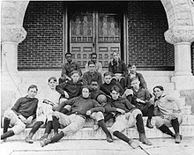 A group of boys seated on stairs