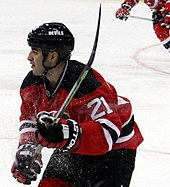 Close up image of an ice hockey player during a game.