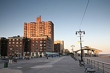 Brighton Beach section of the boardwalk in 2008, with apartment buildings on the left