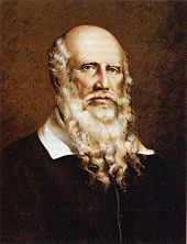 color lithograph of the bust of an elderly white man with a bald head except for long white hair on the sides of his head and a long beard that extends to his breast. His white collar is visible above a simple black coat. His eyes are locked on the viewer's and his countenance is serious but calm.
