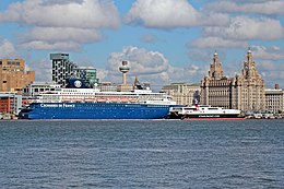 A large cruise ship and smaller high-speed ferry in central Liverpool