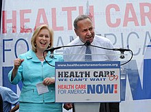 Kirsten Gillibrand and Chuck Schumer are seen giving a speech promoting universal healthcare.