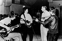 The Beatles with George Martin in the studio in the mid-1960s