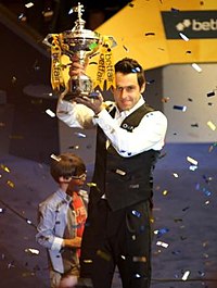 Ronnie O'Sullivan holding the trophy after the final