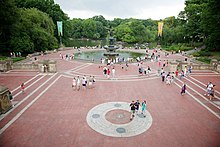 Bethesda Terrace and Fountain with people walking on the Central Park Mall
