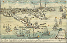 A wide view of a port town with several wharves. In the foreground, there are eight large sailing ships and an assortment of smaller vessels. Soldiers are disembarking from small boats onto a long wharf. The skyline of the town, with nine tall spires and many smaller buildings, is in the distance. A key at the bottom of the drawing indicates some prominent landmarks and the names of the warships.