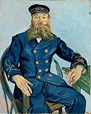 A portrait of a middle aged man with a moustache and beard seated on a chair facing to his left (the viewer's right). He has a thoughtful look on his face and his hands are free while his left arm rests on a table, he is wearing a dark blue uniform and cap, in front of a pale blue background.