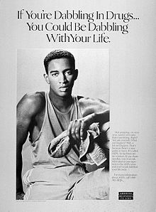 A black-and-white poster of a young black man with a towel in his left hand with the words "If you are dabbling with drugs you could be dabbling with your life" above him