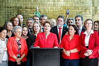 The former president of Brazil, Dilma Rousseff, surrounded by supporters, giving a speech