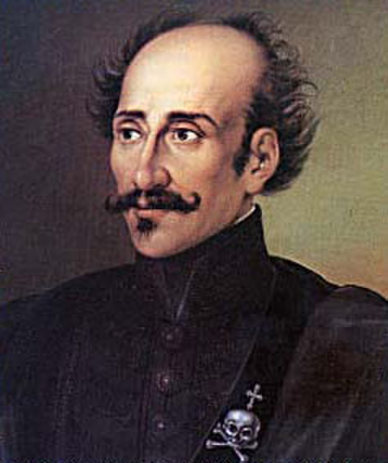 Portrait of a balding man with a handlebar mustache