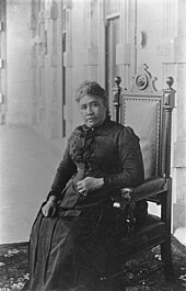 Queen Liliʻuokalani, seated inside ʻIolani Palace