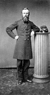 A bearded man in a 19th-century army uniform