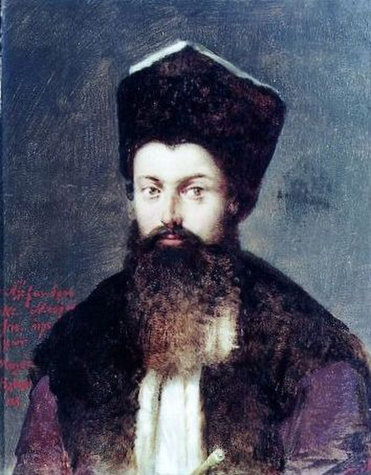 Portrait of a bearded man with a hat