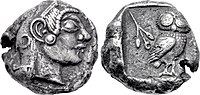 Both sides of a silver coin. One side shows a head in profile; the other an owl.