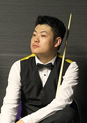 Photograph of a sitting Liang Wenbo
