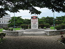 flag sign at flagpole and raised plaza