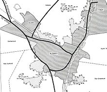 Black and white map shows the boundaries of Albany and surrounding municipalities, crossed with dark black lines representing planned interstate highways.