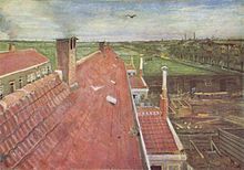 A view from a window of pale red rooftops. A bird flies in the blue sky; in the near distance there are fields and to the right, the town and other buildings can be seen. On the distant horizon are chimneys.