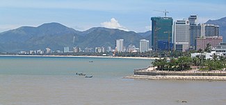 Photograph of Nha Trang beach with many high rise buildings behind it