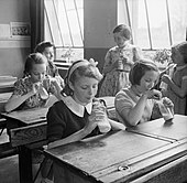 Girls photographed at Baldock County Council School in Hertfordshire enjoy a drink of milk during a break in the school day in 1944.