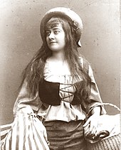 black and white photograph of young white woman in 16th-century peasant costume