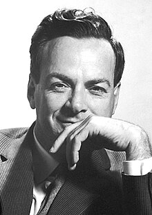 Feynman in a jacket and tie, smiling