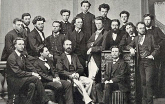 group of 18 young and older men in 19th century dress