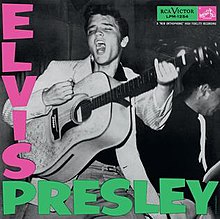 Album cover with photograph of Presley singing—head thrown back, eyes closed, mouth wide open—and about to strike a chord on his acoustic guitar. Another musician is behind him to the right, his instrument obscured. The word "Elvis" in bold pink letters descends from the upper left corner; below, the word "Presley" in bold green letters runs horizontally.